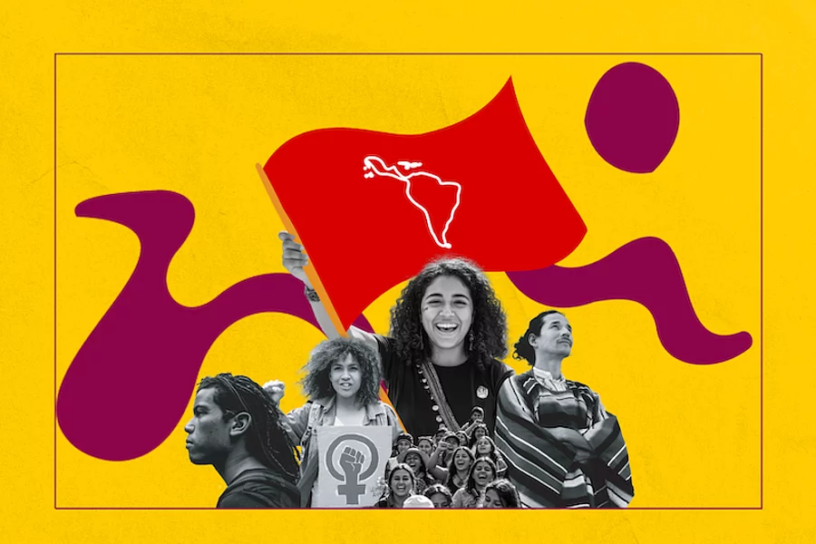 Jventudes diversasen una movilización levantan una bandera con el mapa de América Latina. 